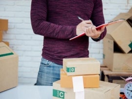 Man checking his product logistics before delivery to customers.