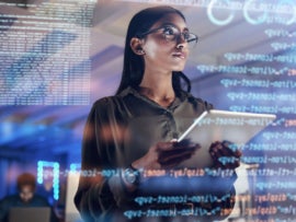 Programmer or IT person in glasses on 3D screen.