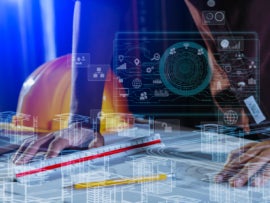 Engineer working over a construction plan with virtual designs and technology accents in the foreground.