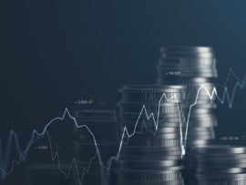 Graph lines on a background of stacked coins.